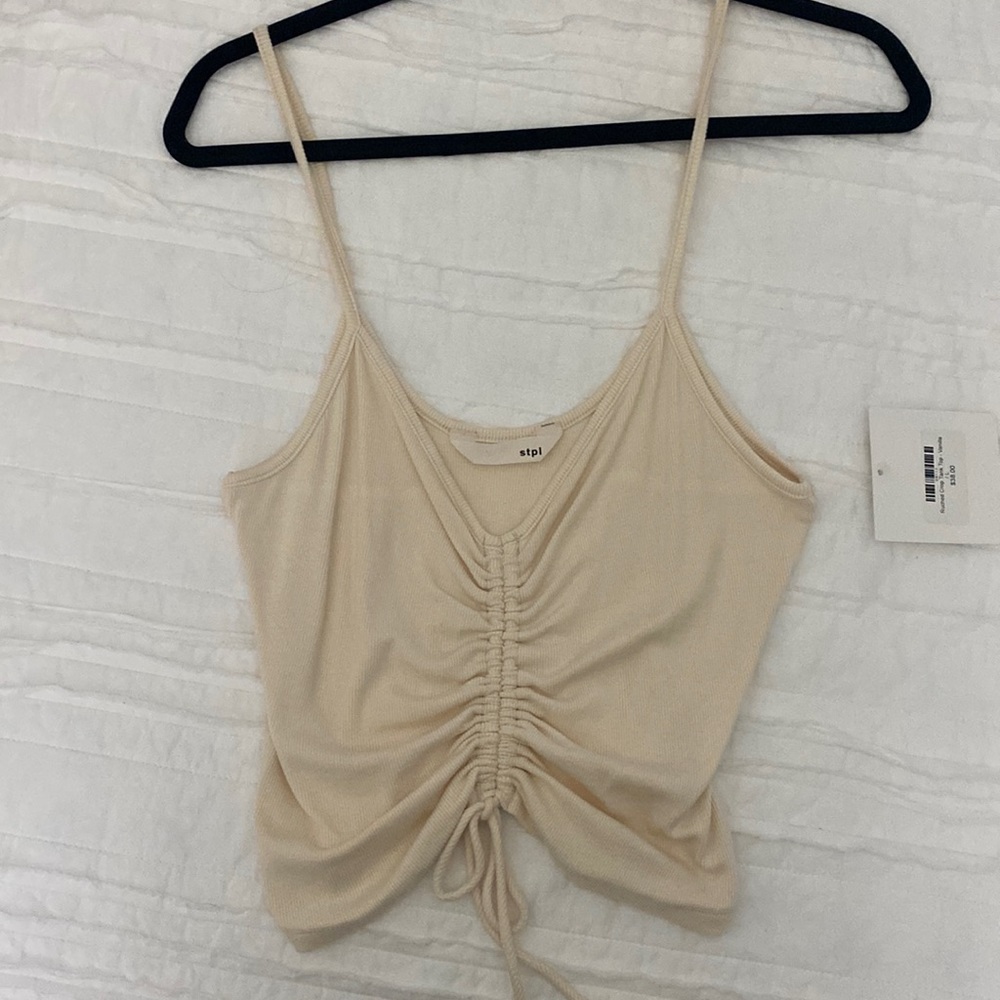 Cream colored crop tank.